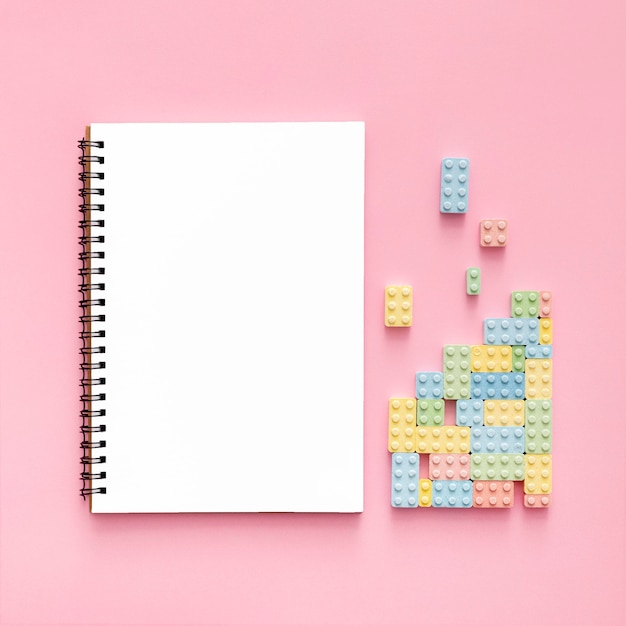 Free photo top view of candy blocks with notebook