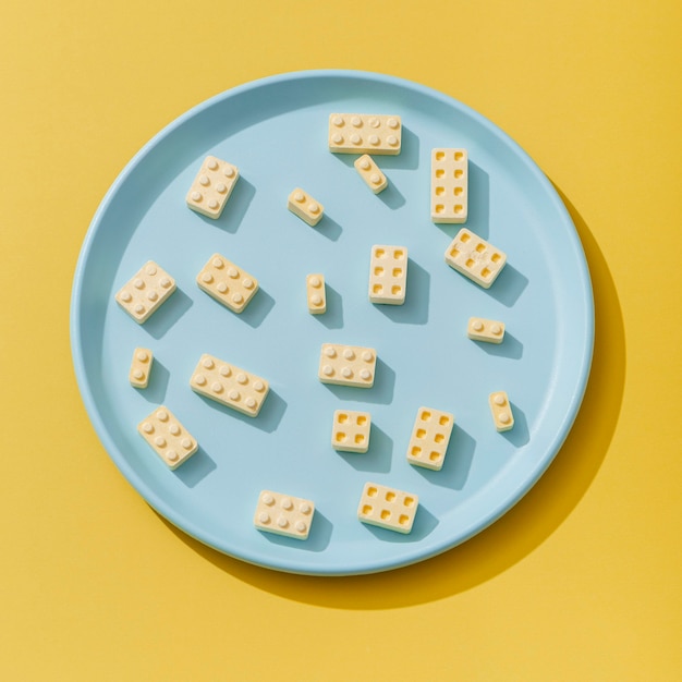 Top view of candy shapes like building block on plate