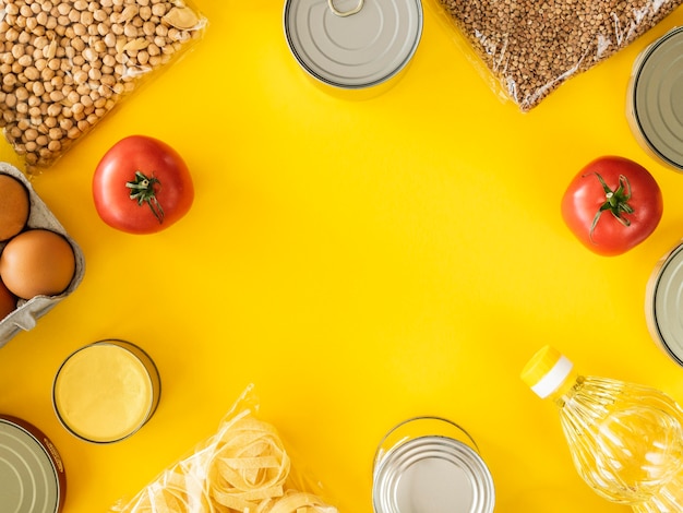 Free photo top view of canned food for donation with copy space