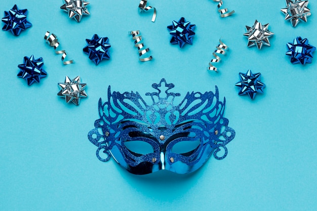 Top view of carnival mask with bows
