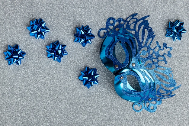 Top view of carnival mask with bows