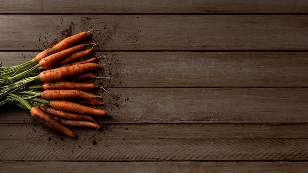 Free photo top view carrots with copy-space