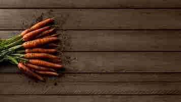 Free photo top view carrots with copy-space