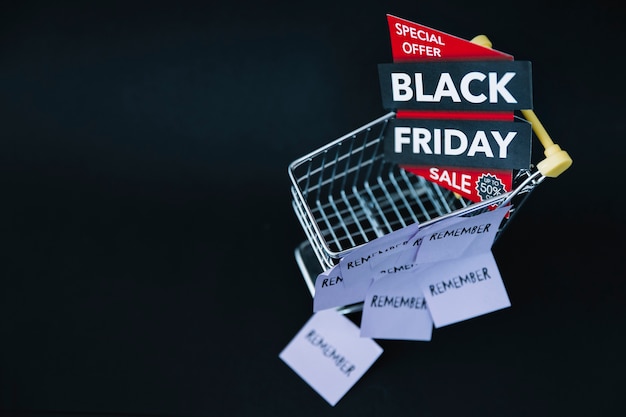 Free photo top view of cart with black friday label