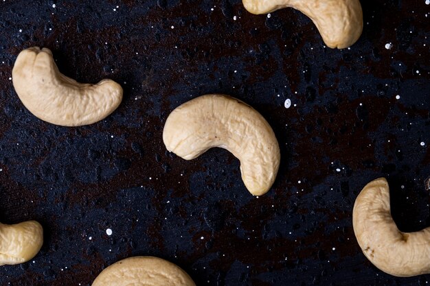 Top view of cashew nuts isolated on black background