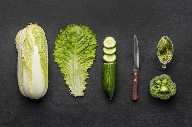 Top view of celery with broccoli and cucumber