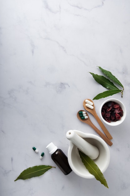 Top view ceramic bowl with capsules on the table