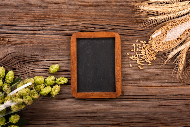 Free photo top view chalkboard with beer ingredients