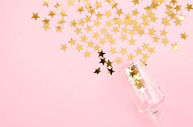 Top view champagne glass with stars