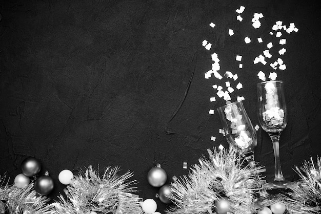 Top view of champagne glasses filled with confetti