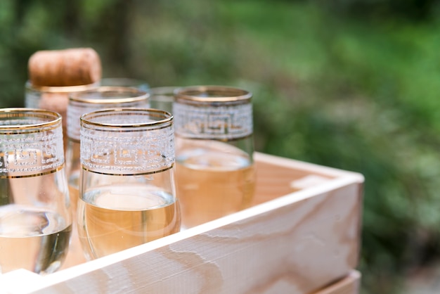 Free photo top view of champagne glasses in wooden crate