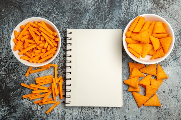 Top view cheese cips with rusks on a light surface