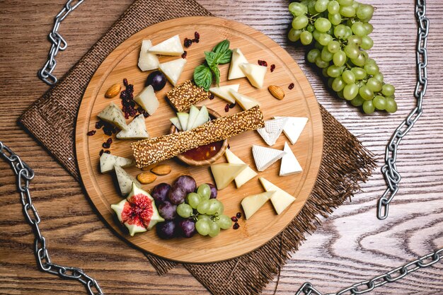 Top view cheese plate with grapes