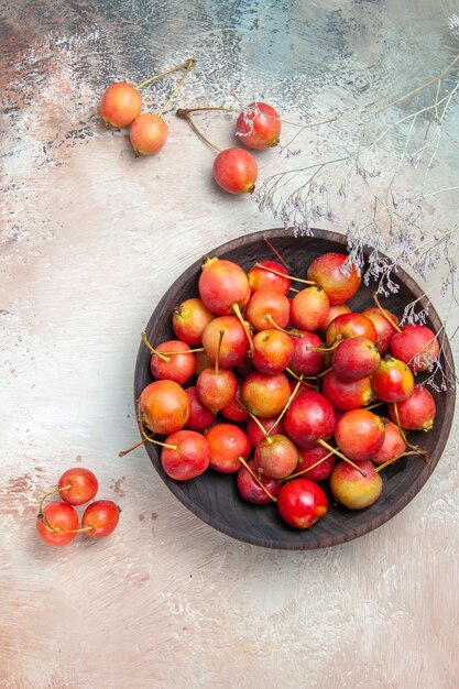 Top view cherries the appetizing cherries in the bowl tree branches