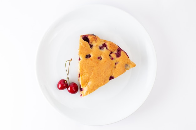 Top view cherry cake slice inside white plate on the white background cake biscuit sweet dough bake