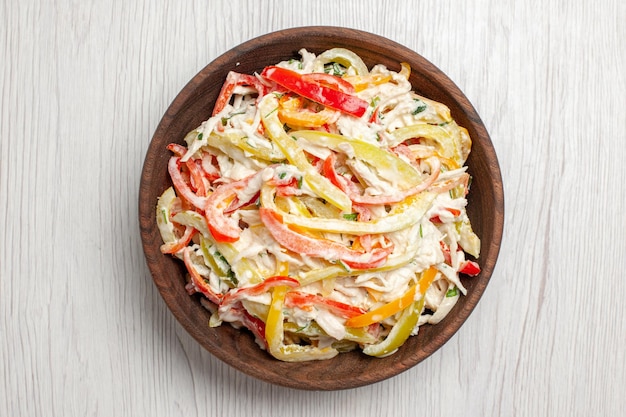 Top view chicken salad with mayyonaise and sliced vegetables inside plate on white desk fresh salad meat snack meal