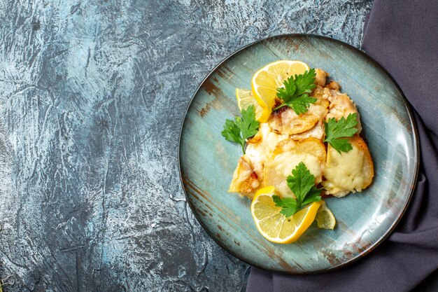 Top view chicken with cheese on plate on grey table copy place