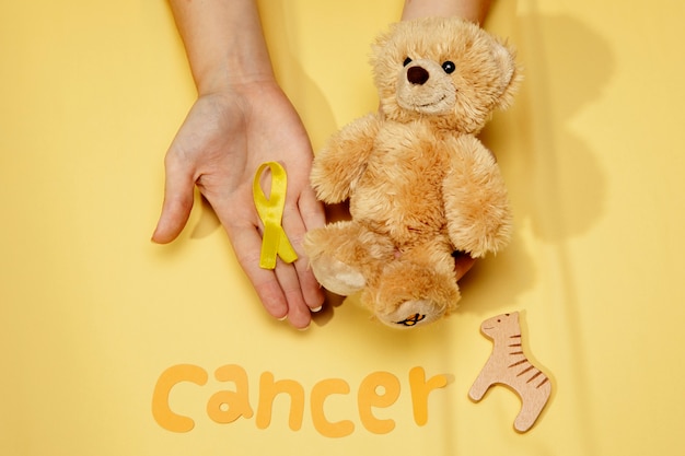 Top view over childhood cancer awareness month background concepttoys,