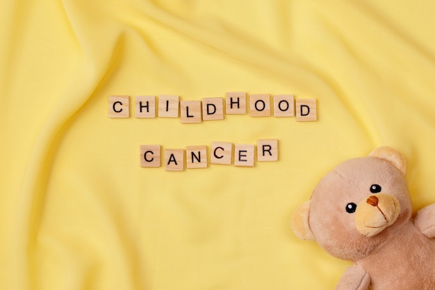 Top view over childhood cancer awareness month background concepttoys,