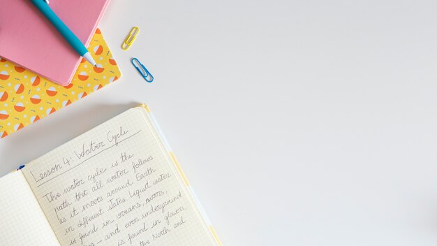 Top view of children's desk with notebook and copy space