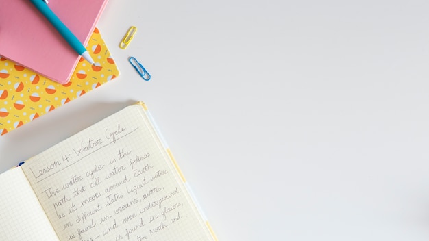 Top view of children's desk with notebook and copy space