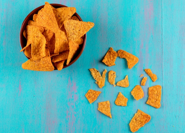 Top view chips in bowl on blue  horizontal