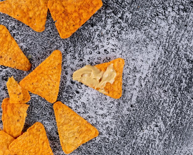 Top view chips with sause on white stone  horizontal