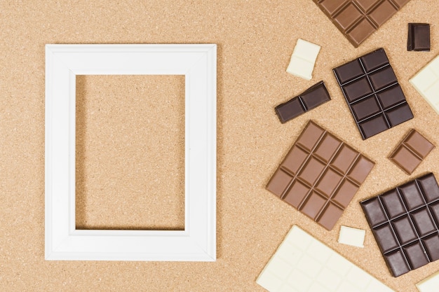Free photo top view chocolate arrangement with frame