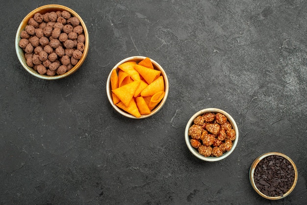top-view-chocolate-flakes-with-nuts-dark-background-many-flake-color_140725-117588.jpg