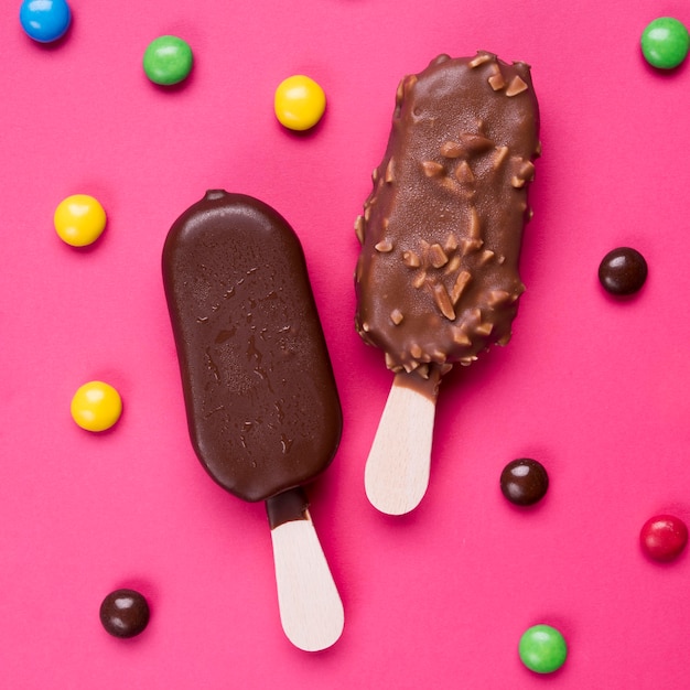 Top view chocolate ice creams with candy