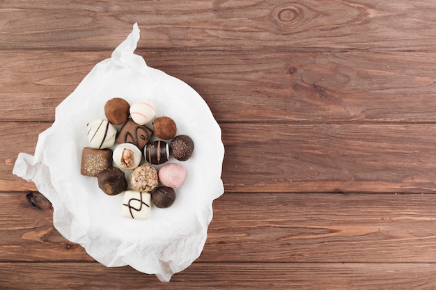 Free photo top view chocolate selection on a plate