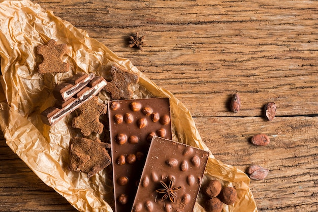 Top view chocolates assortment on wooden table