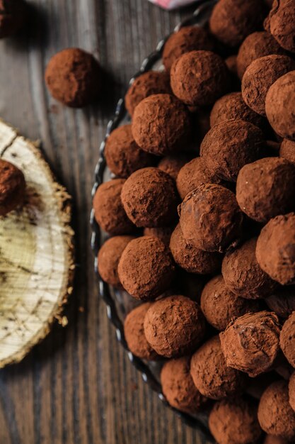 Top view chocolates in cocoa on a plate