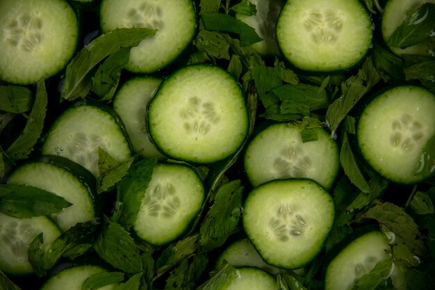 Top view of chopped cucumbers with mint