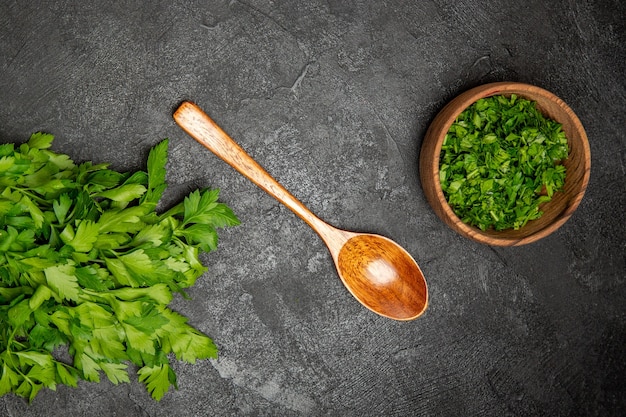 Top view of chopped greens and spoon