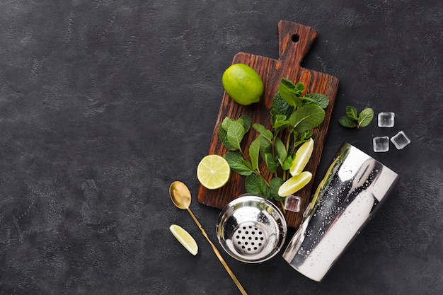 Free photo top view of chopping board with cocktail essentials and copy space