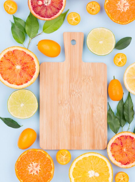 Top view chopping board with organic fruits