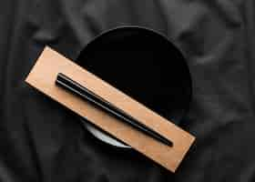 Free photo top view of chopsticks on plate