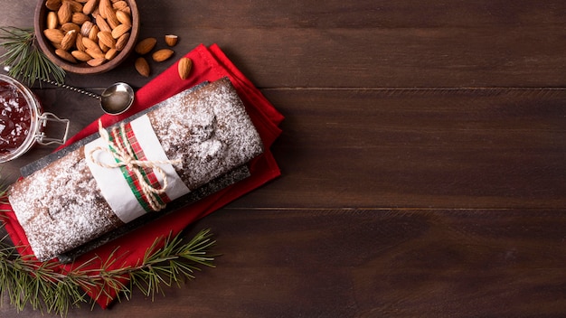 Free photo top view of christmas cake with almonds and copy space