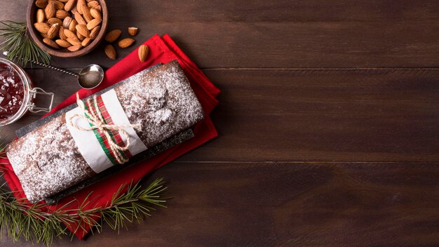 Top view of christmas cake with almonds and copy space