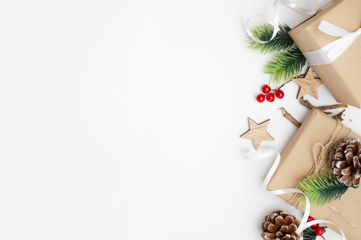 Free Photo top view of christmas composition with gift box, ribbon, fir branches, cones, anise on white table