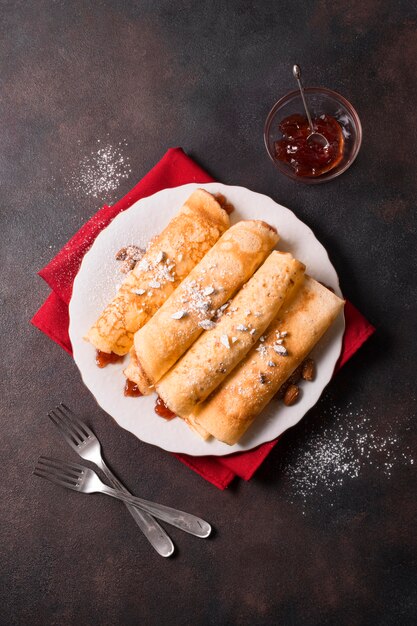 Top view of christmas crepes with jam