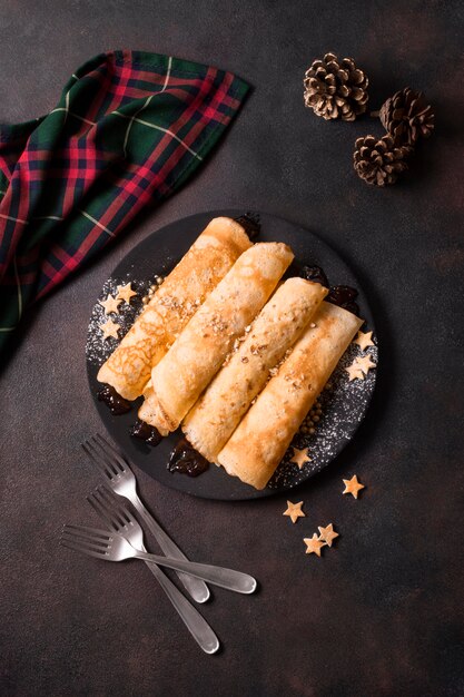 top view of christmas crepes with pine cones