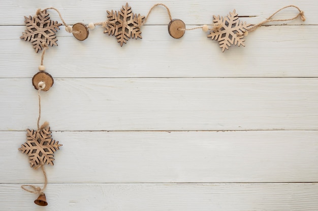 Top view christmas decorative snowflakes on wooden board