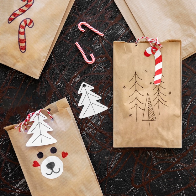 Top view of christmas gift bags with candy canes