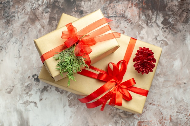 Free photo top view christmas presents tied with red bow on white background