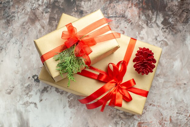 Top view christmas presents tied with red bow on white background