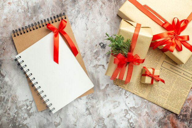 Free photo top view christmas presents with red bows on a white background