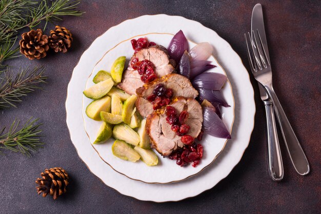 Top view of christmas steak on plate with cutlery