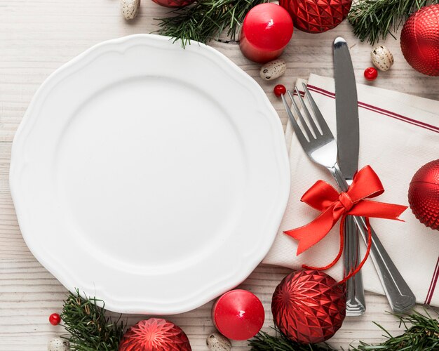 Top view christmas tableware with empty plate